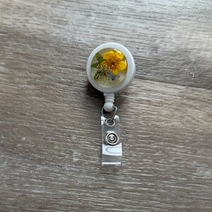 Floral Resin Badge Reel with Yellow Pressed Flower